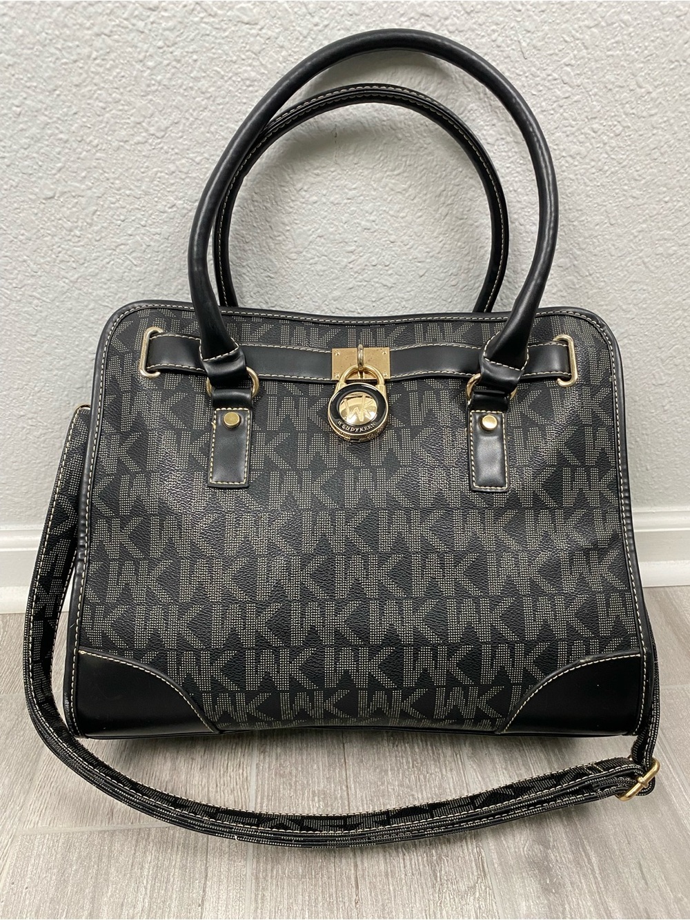 Wendy Keen black monogram shoulder hand bag with a gold lock detail.